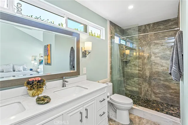 a bedroom with a bed and a couch