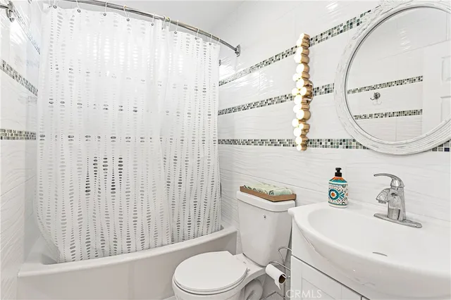 a view of walk in closet with clothes