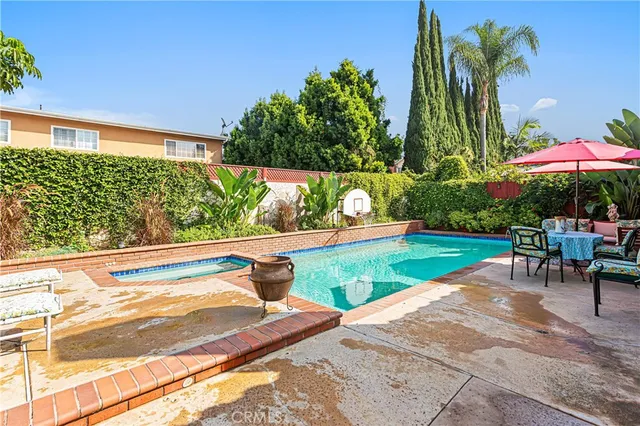 an outdoor sitting area with furniture and wooden floor