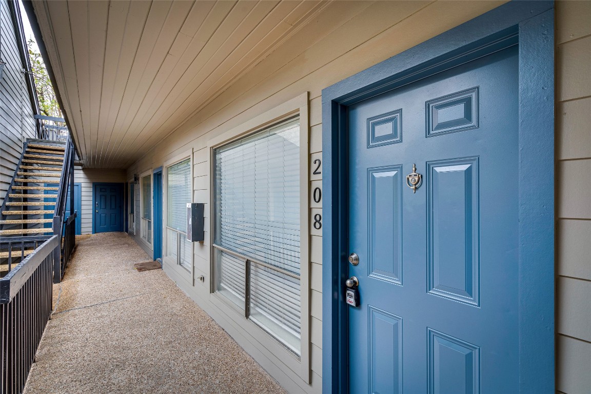908 Poplar Street, Unit 208 Austin, TX 78705 - Photo 3 of 26 a view of hallway with stairs