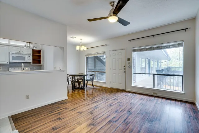 a view of livingroom with furniture fan and window