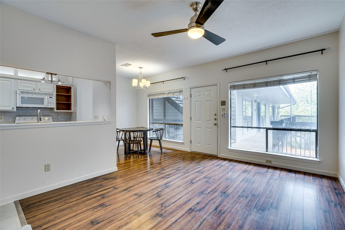 908 Poplar Street, Unit 208 Austin, TX 78705 - Photo 7 of 26 a view of livingroom with furniture fan and window
