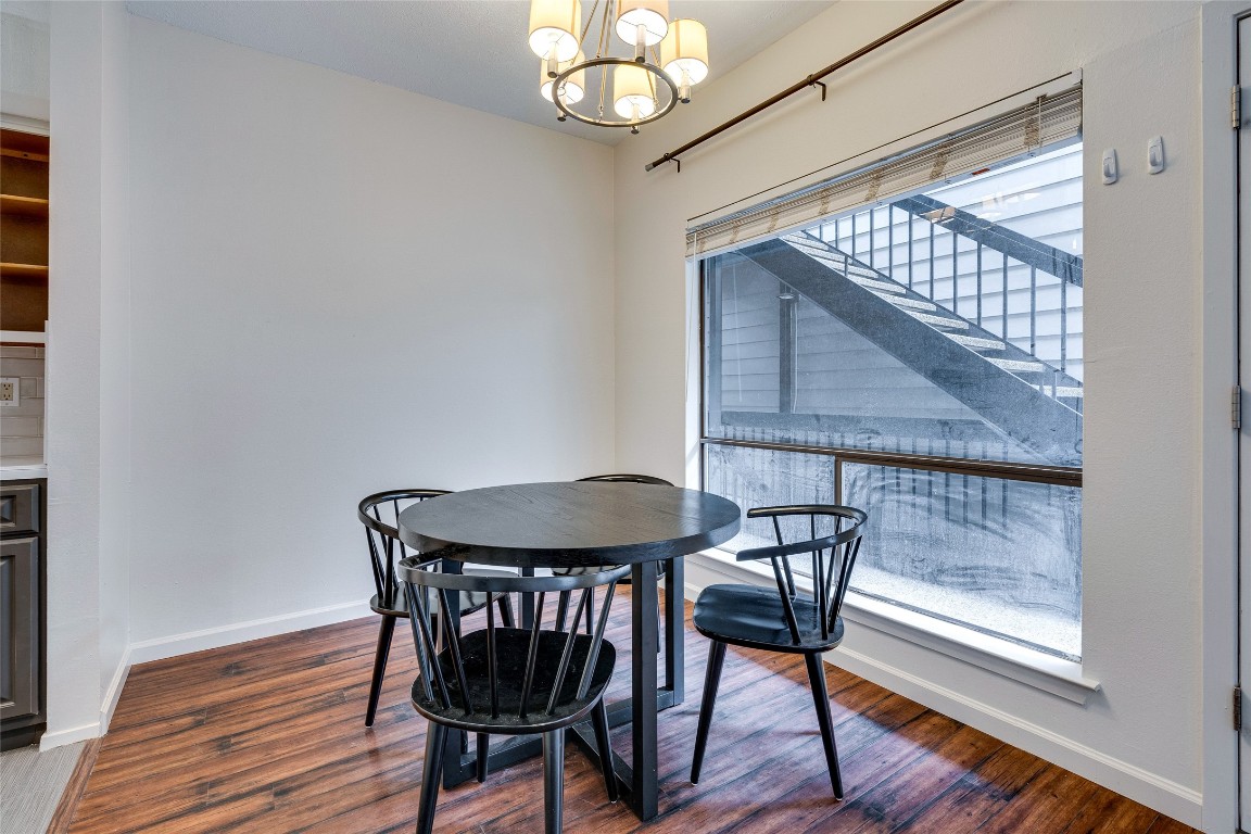 908 Poplar Street, Unit 208 Austin, TX 78705 - Photo 9 of 26 a view of a dining room with furniture window and wooden floor