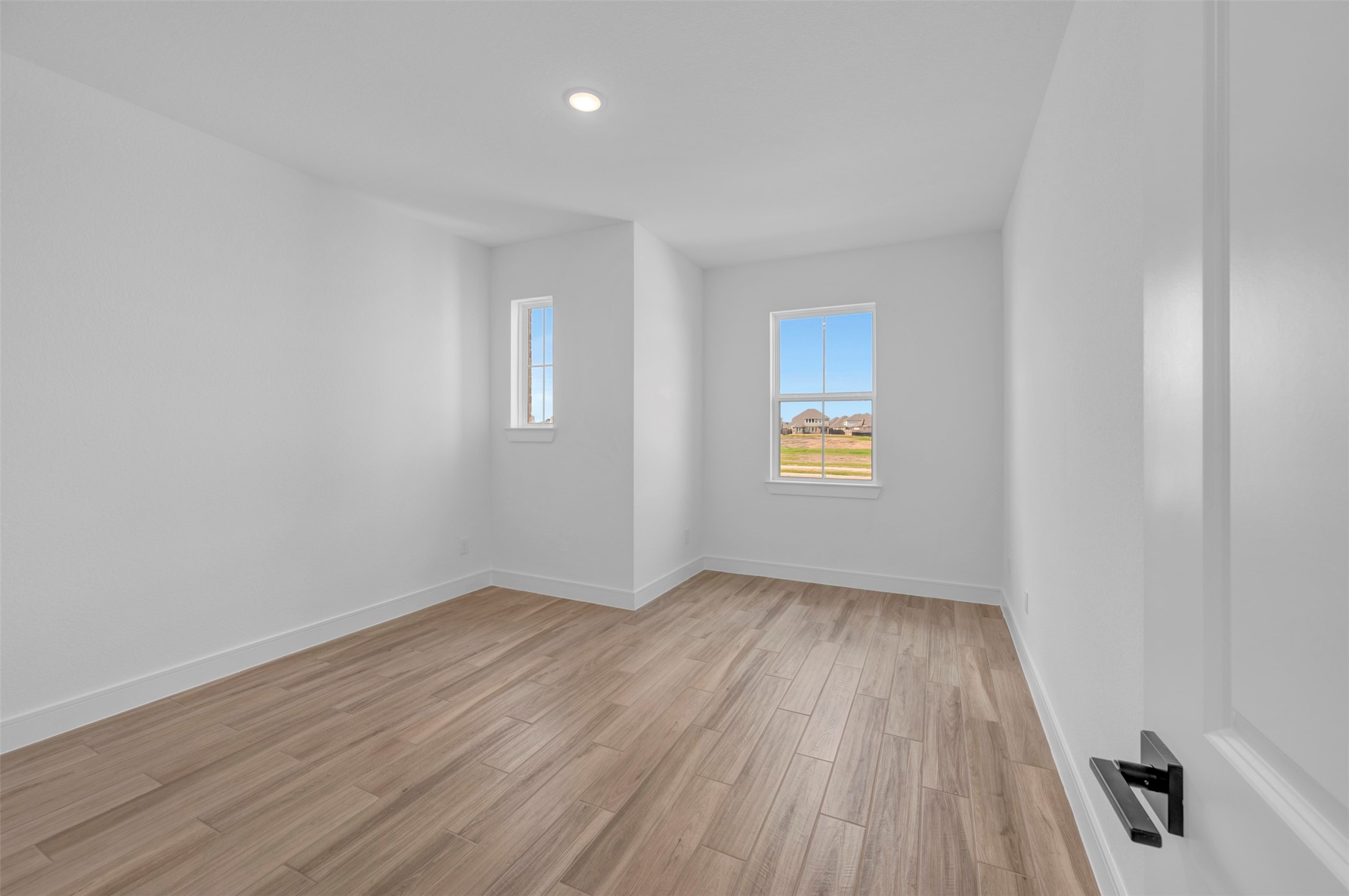 2819 Duchess Drive Rosenberg, TX 77471 - Photo 5 of 37 an empty room with wooden floor and windows