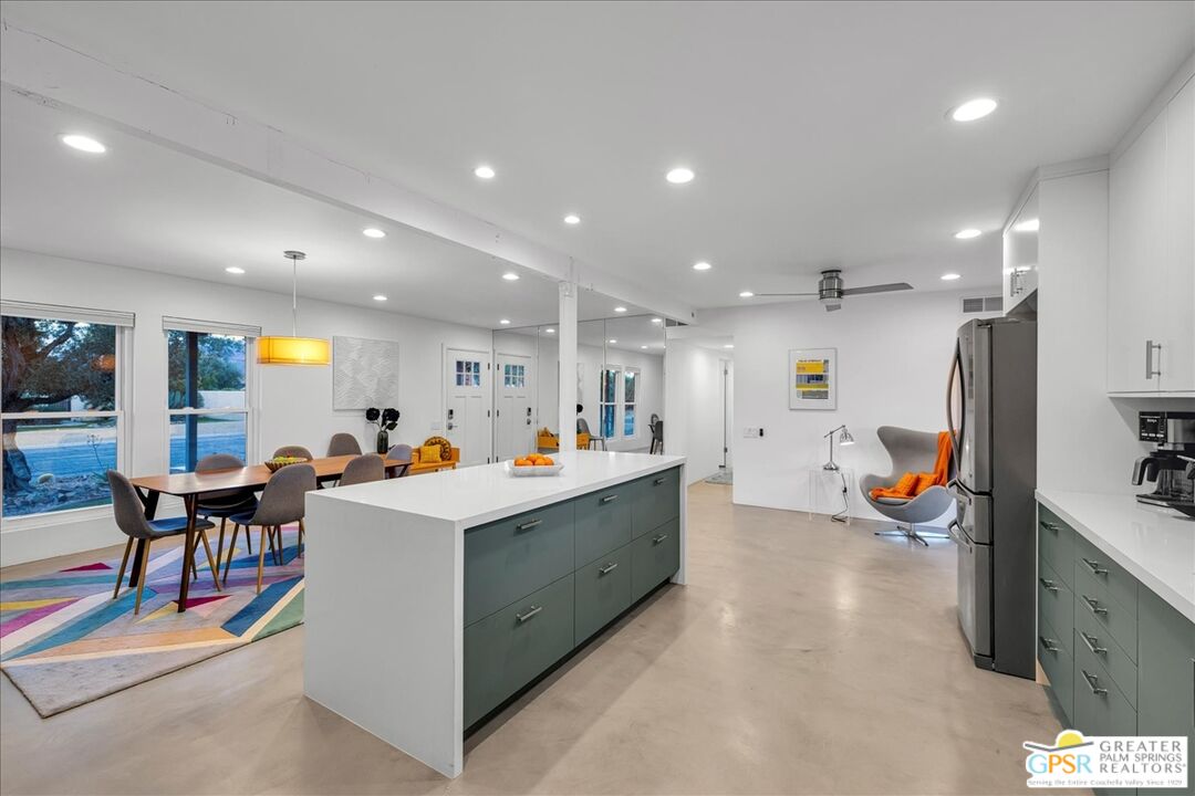 2210 East Powell Road Palm Springs, CA 92262 - Photo 14 of 71 a view of counter top space with stainless steel appliances lots of furniture