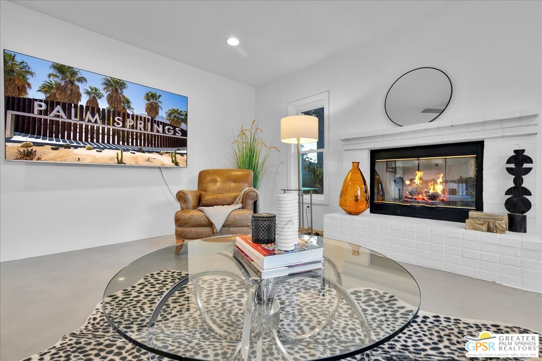 2210 East Powell Road Palm Springs, CA 92262 - Photo 19 of 71 a living room with furniture and a flat screen tv