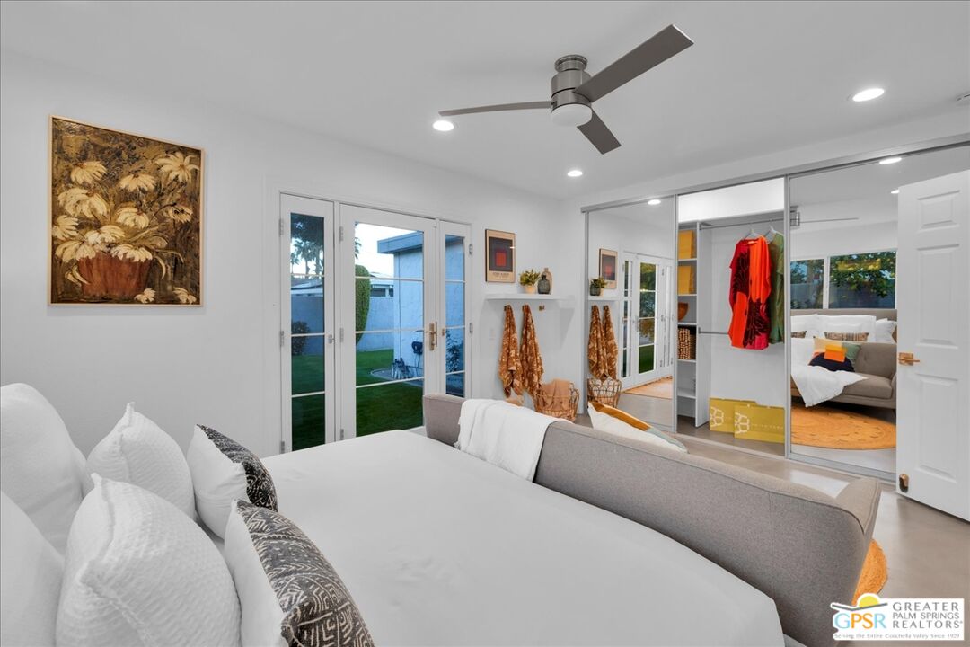 2210 East Powell Road Palm Springs, CA 92262 - Photo 24 of 71 a bed room with a bed and a walk in closet