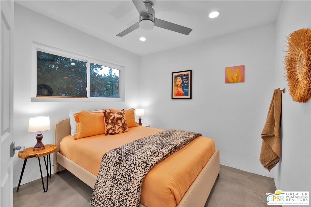 2210 East Powell Road Palm Springs, CA 92262 - Photo 30 of 71 a bedroom with a bed and wooden floor