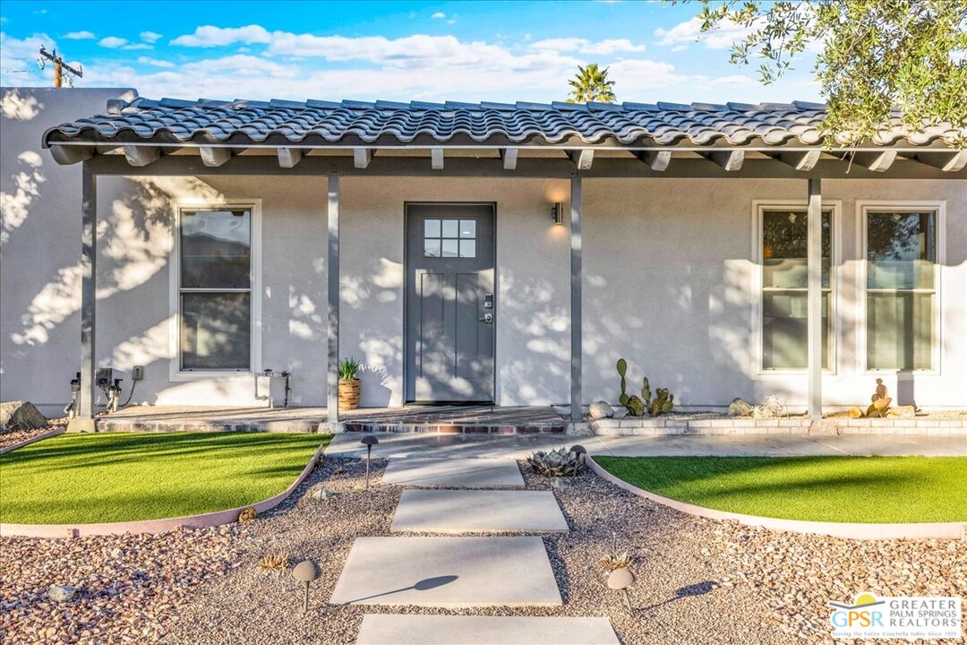 2210 East Powell Road Palm Springs, CA 92262 - Photo 3 of 71 a view of a house with a swimming pool and sitting area