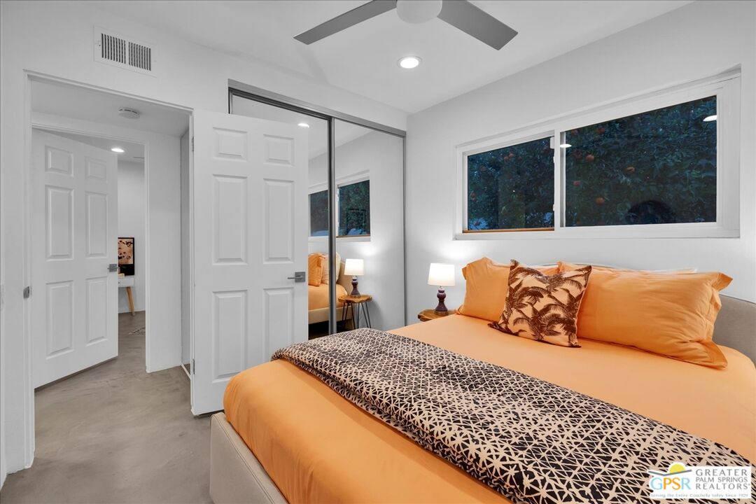 2210 East Powell Road Palm Springs, CA 92262 - Photo 31 of 71 a bedroom with a large bed and a large window