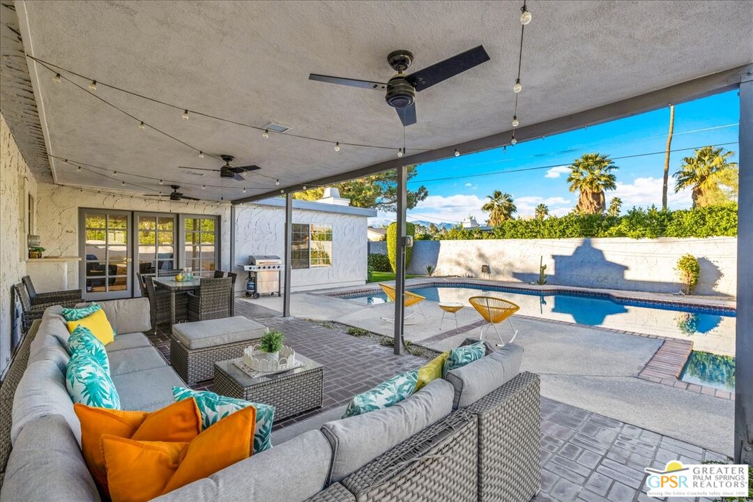 2210 East Powell Road Palm Springs, CA 92262 - Photo 37 of 71 a living room with furniture and floor to ceiling window