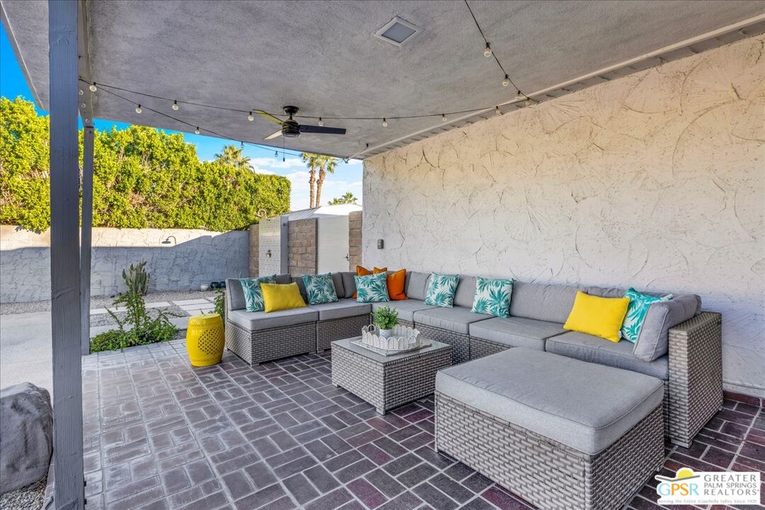 2210 East Powell Road Palm Springs, CA 92262 - Photo 38 of 71 a outdoor space with patio couch and a fireplace