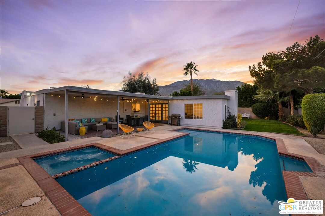 2210 East Powell Road Palm Springs, CA 92262 - Photo 47 of 71 a view of a house with pool and chairs