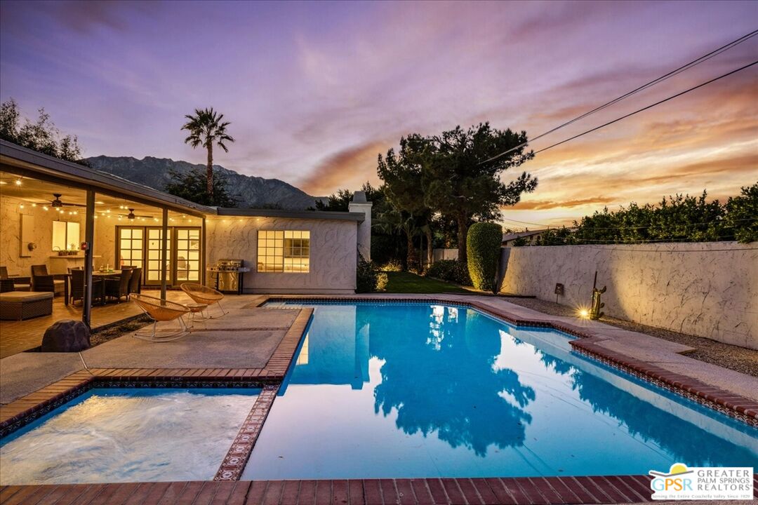 2210 East Powell Road Palm Springs, CA 92262 - Photo 52 of 71 a view of a house with swimming pool and sitting area
