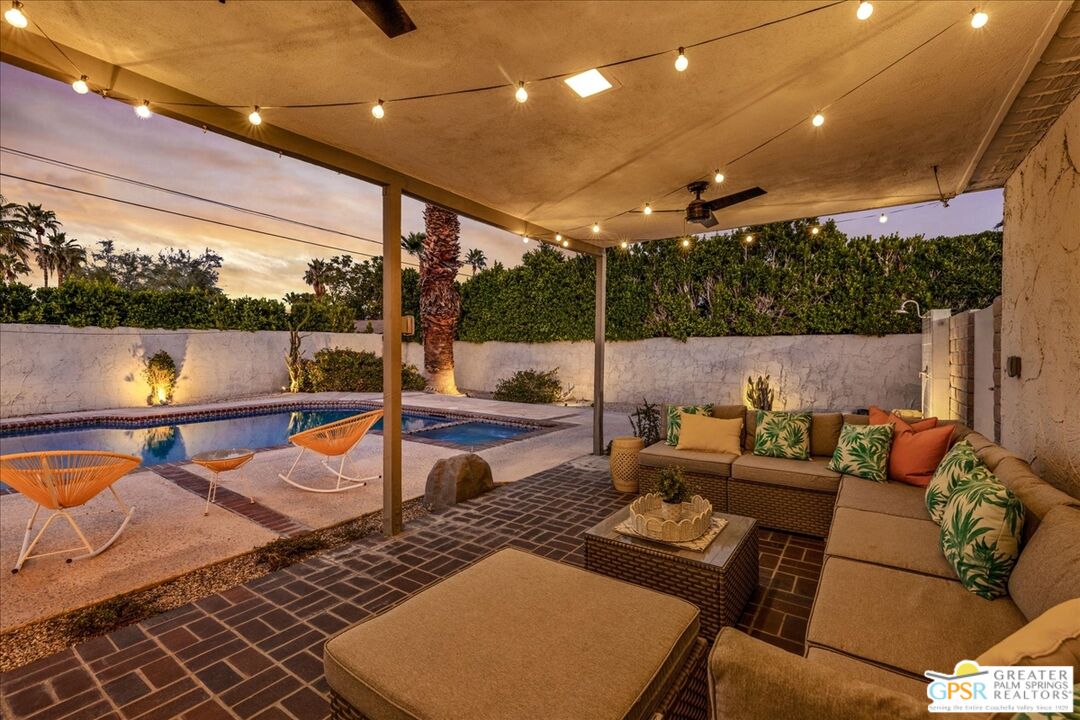 2210 East Powell Road Palm Springs, CA 92262 - Photo 56 of 71 a outdoor living space with patio furniture and a potted plant