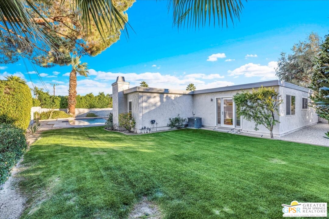 2210 East Powell Road Palm Springs, CA 92262 - Photo 59 of 71 a view of a house with a backyard