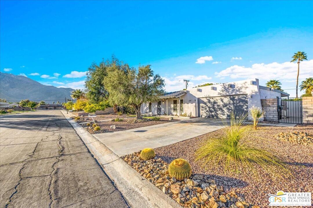 2210 East Powell Road Palm Springs, CA 92262 - Photo 68 of 71 a view of a swimming pool with an outdoor seating