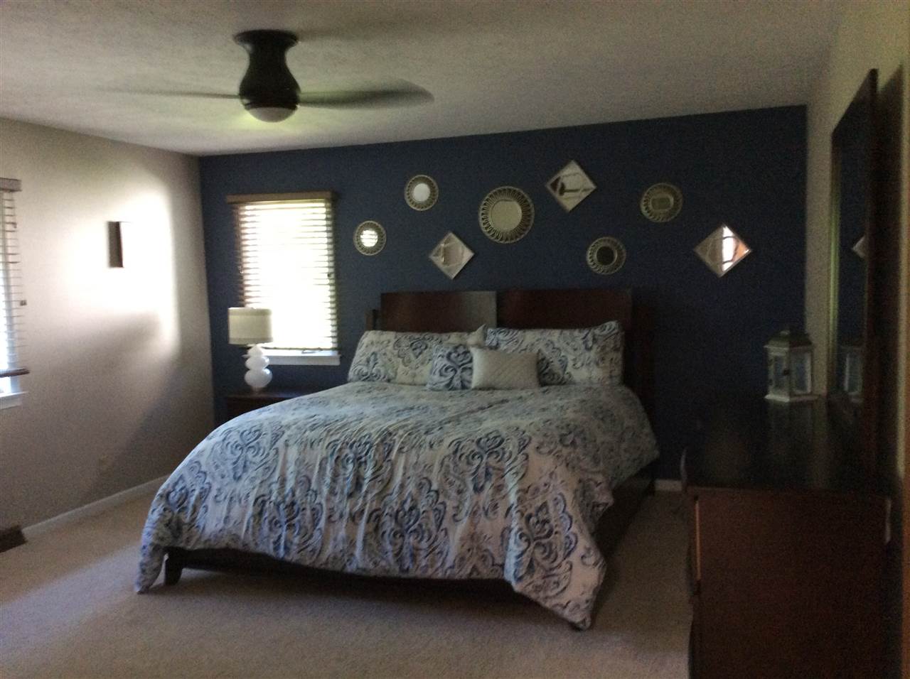 7169 Sentinel Road Rockford, IL 61107 - Photo 13 of 25 a bedroom with a bed and a lamp on the dresser
