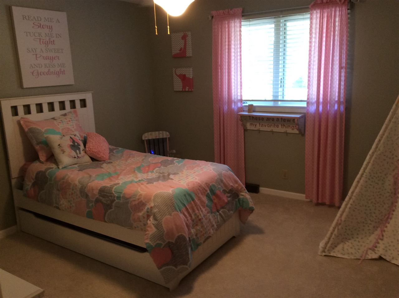 7169 Sentinel Road Rockford, IL 61107 - Photo 17 of 25 a bed sitting in a bedroom next to a window