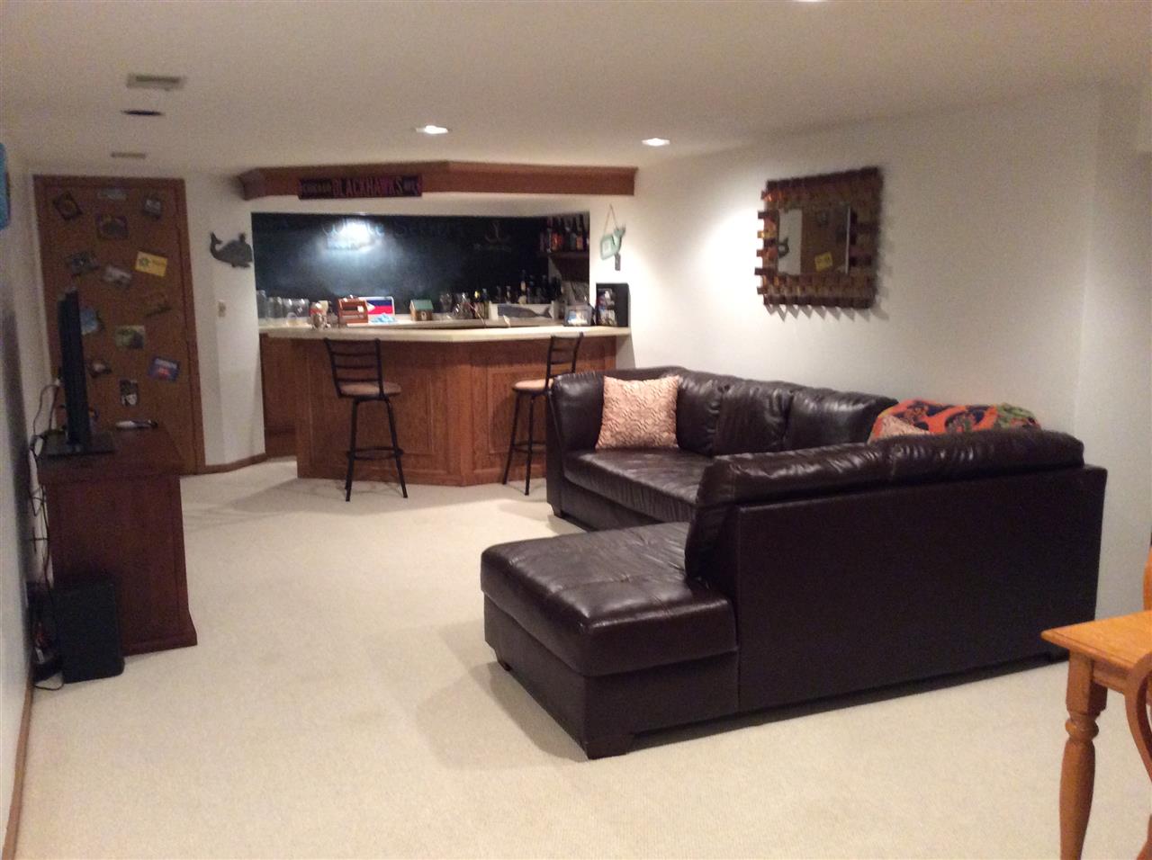 7169 Sentinel Road Rockford, IL 61107 - Photo 21 of 25 a living room with furniture and a flat screen tv