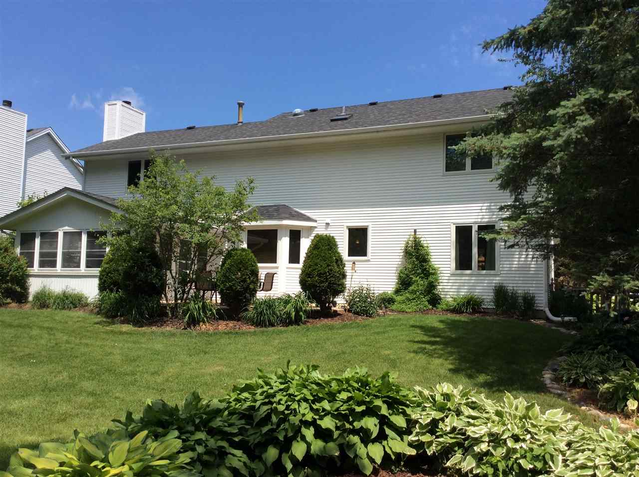 7169 Sentinel Road Rockford, IL 61107 - Photo 24 of 25 a front view of a house with a garden