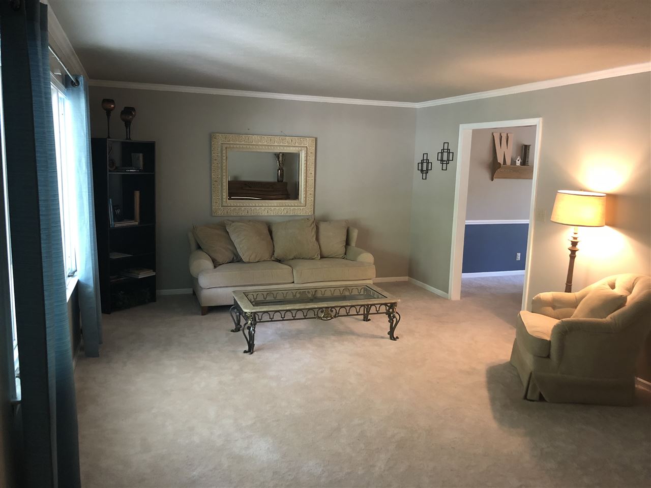 7169 Sentinel Road Rockford, IL 61107 - Photo 3 of 25 a living room with furniture and a lamp