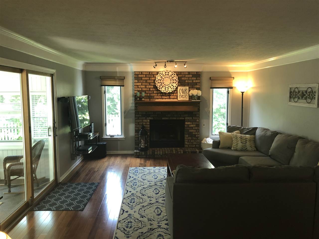 7169 Sentinel Road Rockford, IL 61107 - Photo 7 of 25 a living room with furniture and a fireplace
