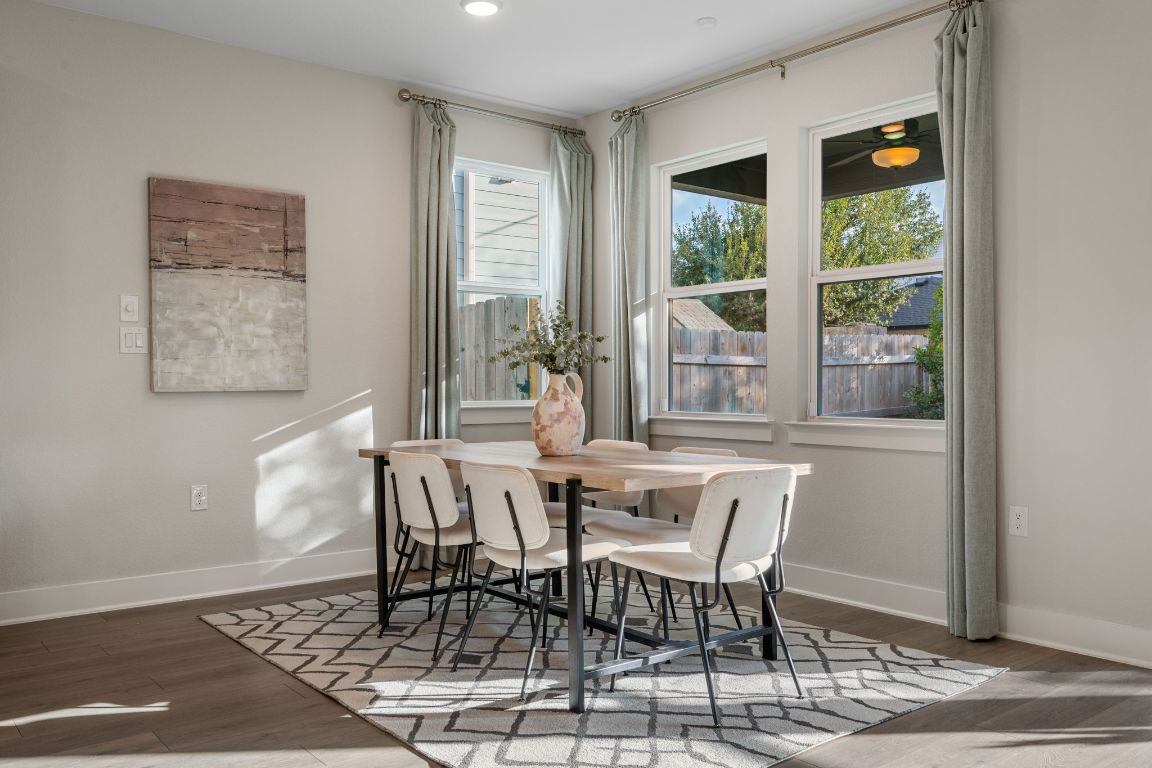 1403 Iberville Drive Pflugerville, TX 78660 - Photo 17 of 40 a dining room with furniture and window