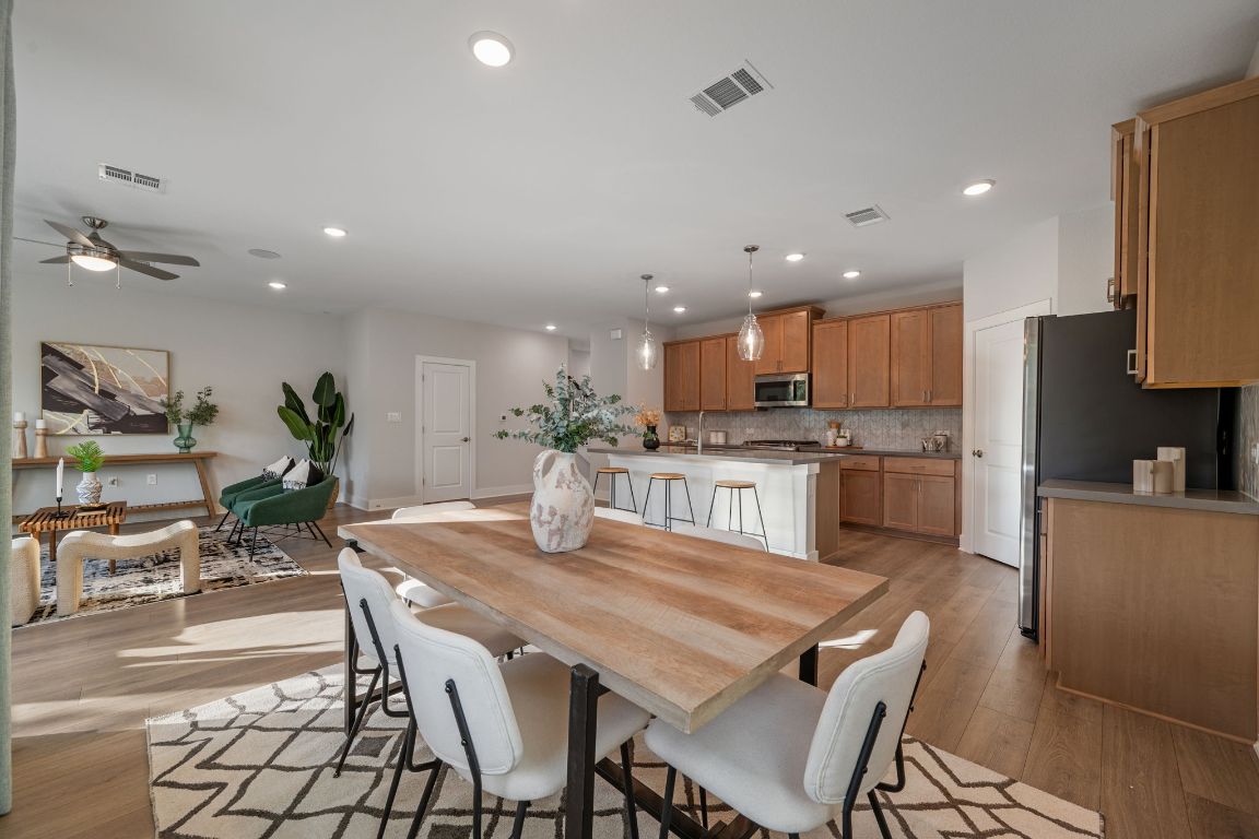 1403 Iberville Drive Pflugerville, TX 78660 - Photo 18 of 40 a view of a dining room with furniture