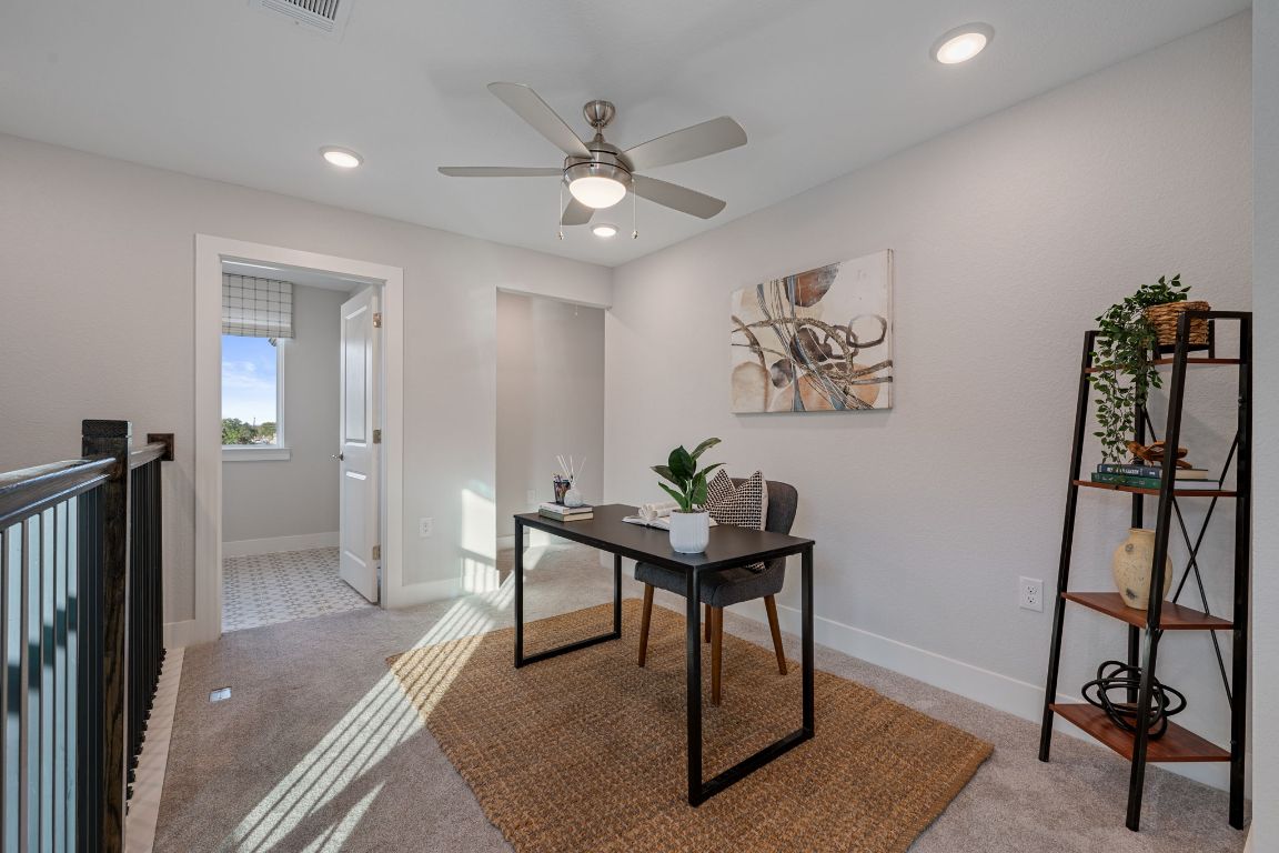 1403 Iberville Drive Pflugerville, TX 78660 - Photo 20 of 40 a view of a workspace with furniture and a window