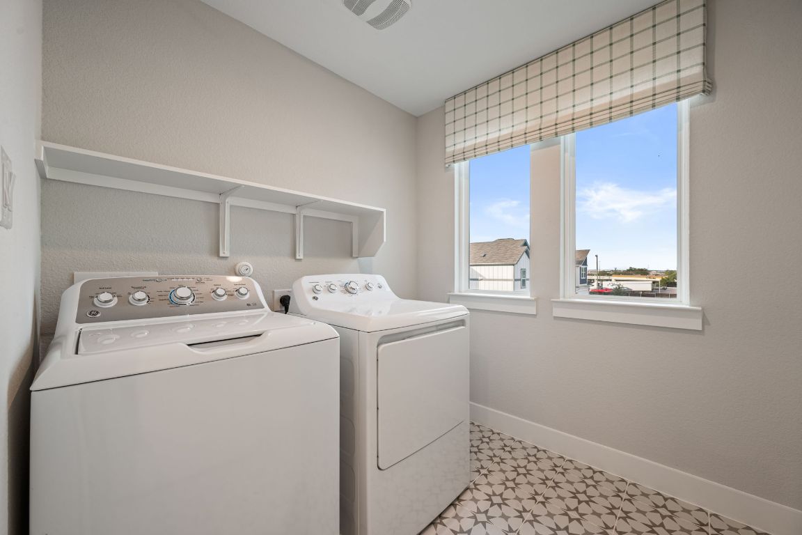 1403 Iberville Drive Pflugerville, TX 78660 - Photo 30 of 40 a utility room with dryer and washer