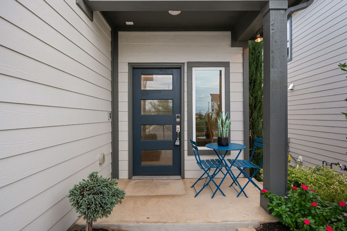 1403 Iberville Drive Pflugerville, TX 78660 - Photo 3 of 40 a bench and table in front of a house