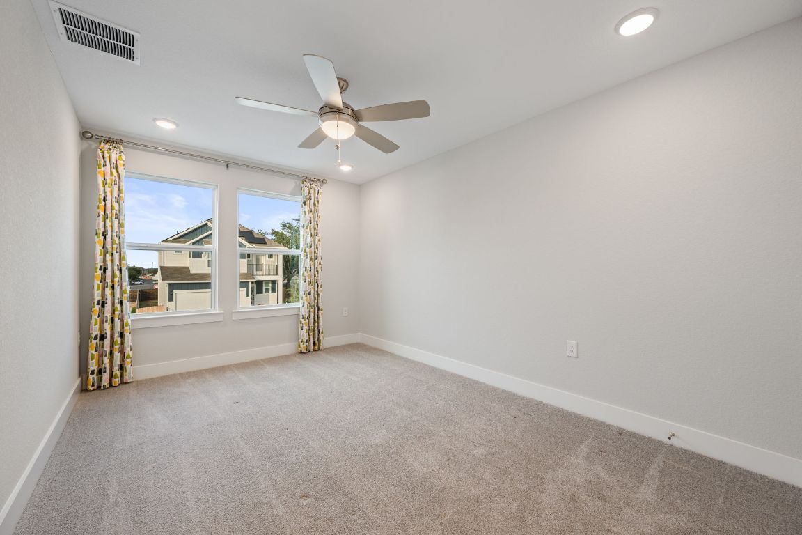 1403 Iberville Drive Pflugerville, TX 78660 - Photo 32 of 40 a view of an empty room with a window