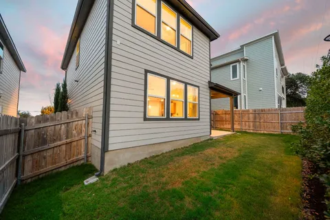 a backyard of a house with lots of green space