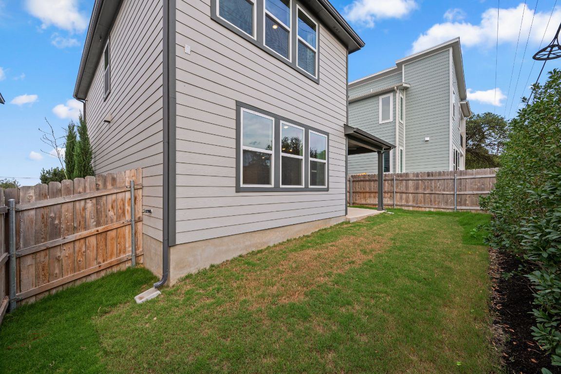 1403 Iberville Drive Pflugerville, TX 78660 - Photo 37 of 40 a front view of a house with garden