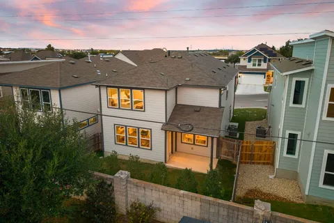aerial view of a residential apartment building with a yard