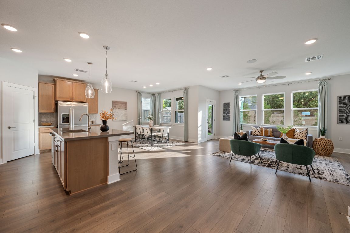 1403 Iberville Drive Pflugerville, TX 78660 - Photo 5 of 40 a living room with furniture and wooden floor