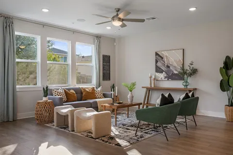 a living room with furniture and a window