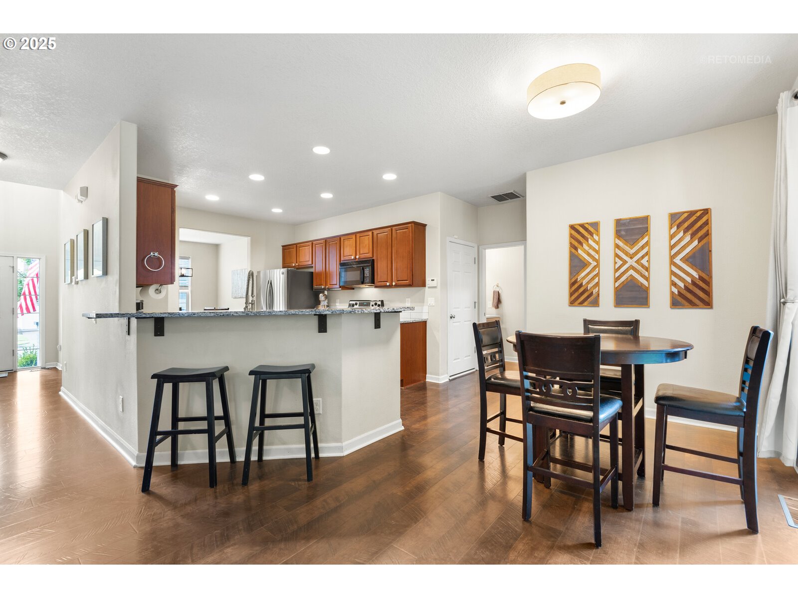 20102 Southwest 54th Terrace Tualatin, OR 97062 - Photo 15 of 35 a view of kitchen with dining table and chairs