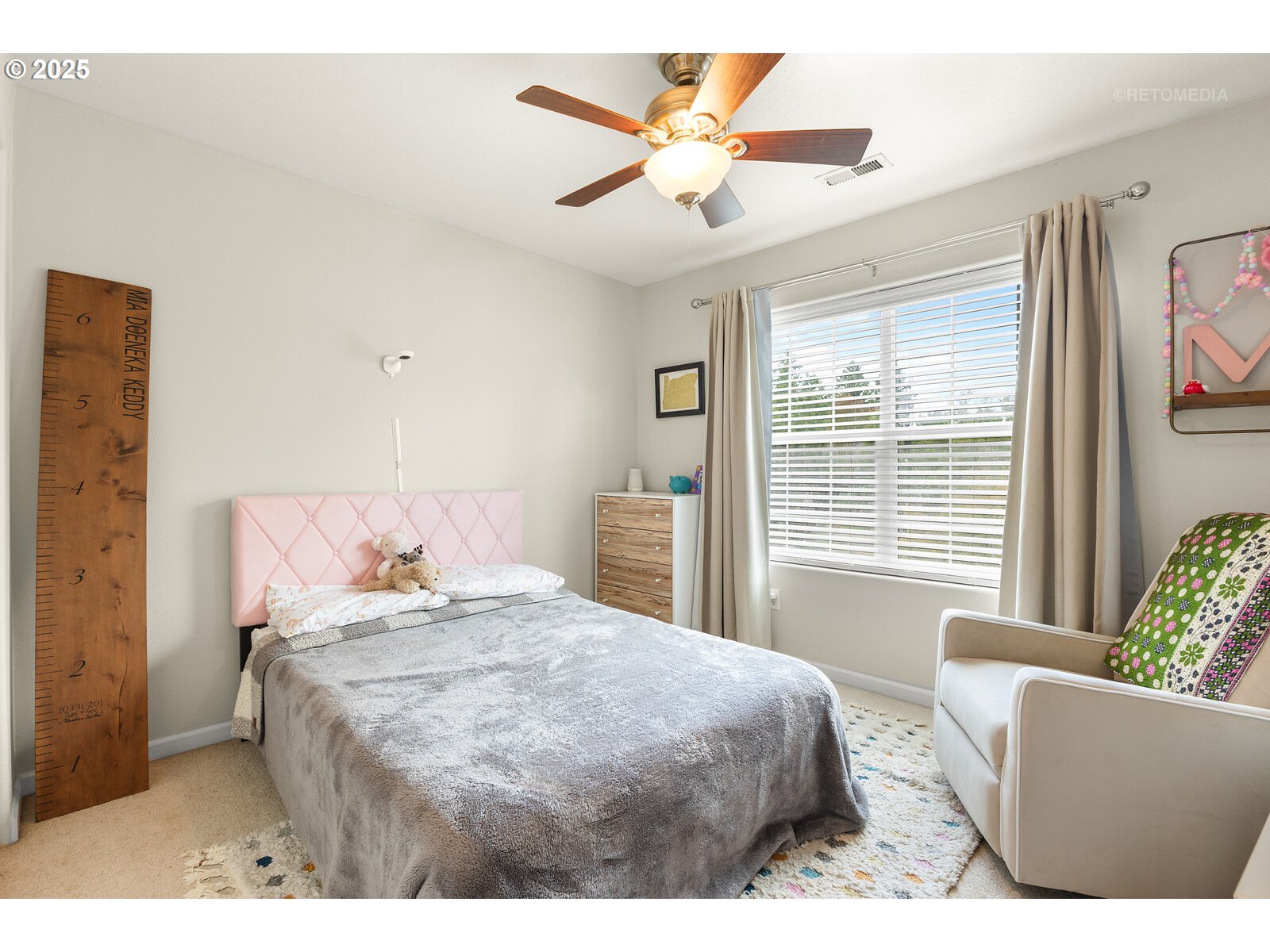 20102 Southwest 54th Terrace Tualatin, OR 97062 - Photo 21 of 35 a bedroom with a large bed and a window