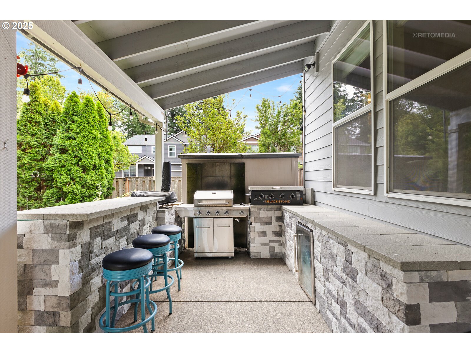 20102 Southwest 54th Terrace Tualatin, OR 97062 - Photo 29 of 35 a view of open kitchen with outdoor seating and barbeque oven