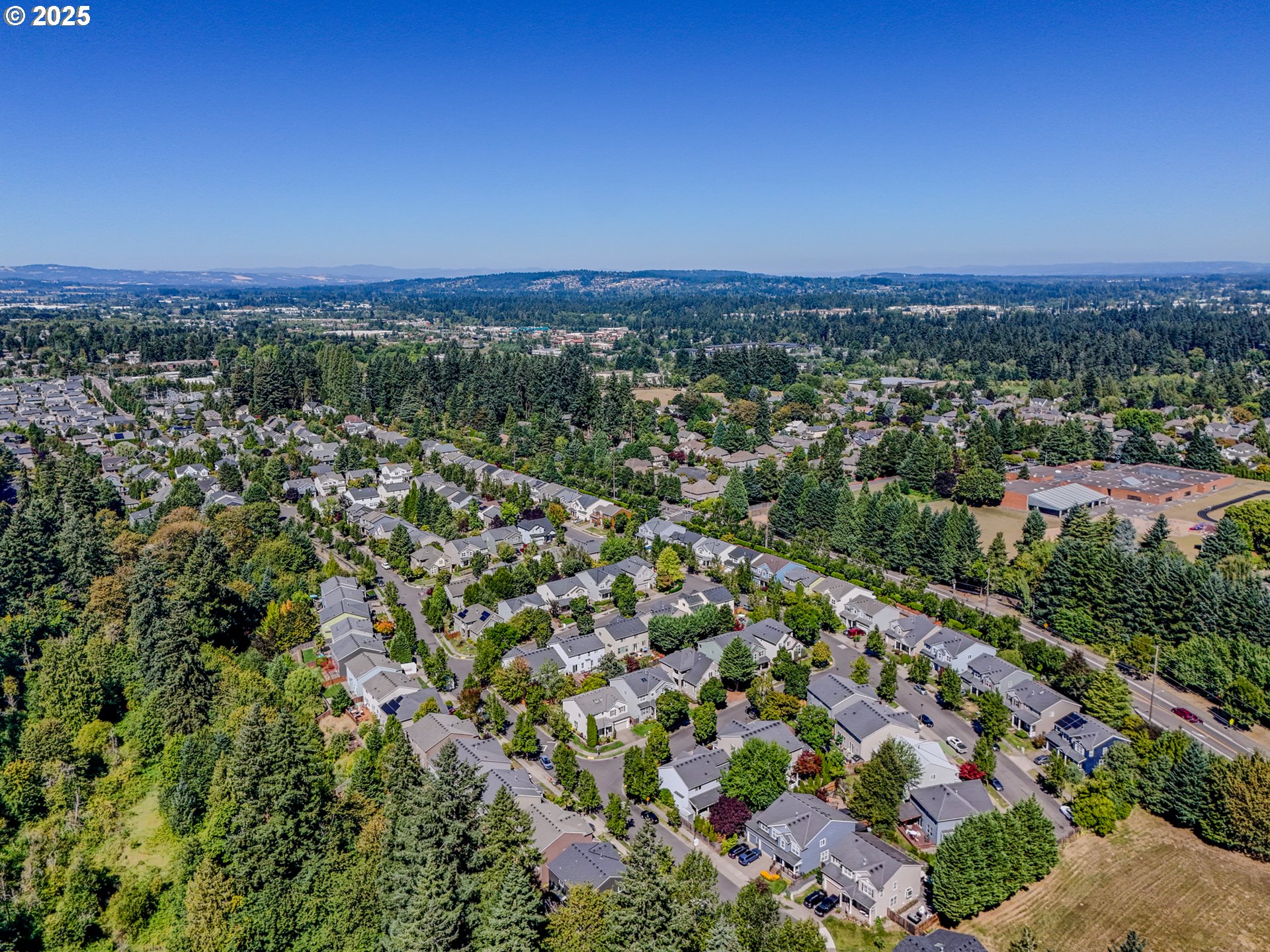 20102 Southwest 54th Terrace Tualatin, OR 97062 - Photo 35 of 35 an aerial view of a city with lots of residential buildings