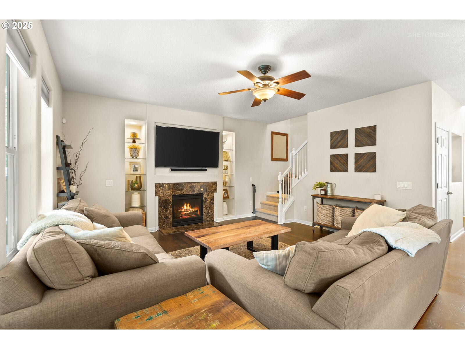 20102 Southwest 54th Terrace Tualatin, OR 97062 - Photo 6 of 35 a living room with furniture a fireplace and a flat screen tv