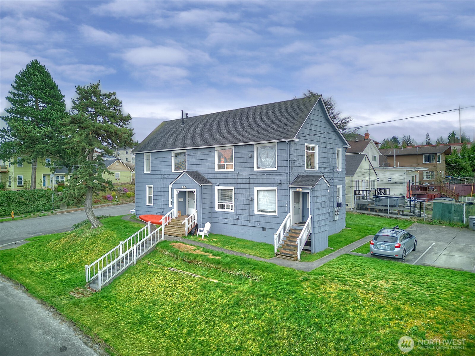 1018 Wall Street Everett, WA 98201 - Photo 3 of 20 a front view of a house with a yard and trees