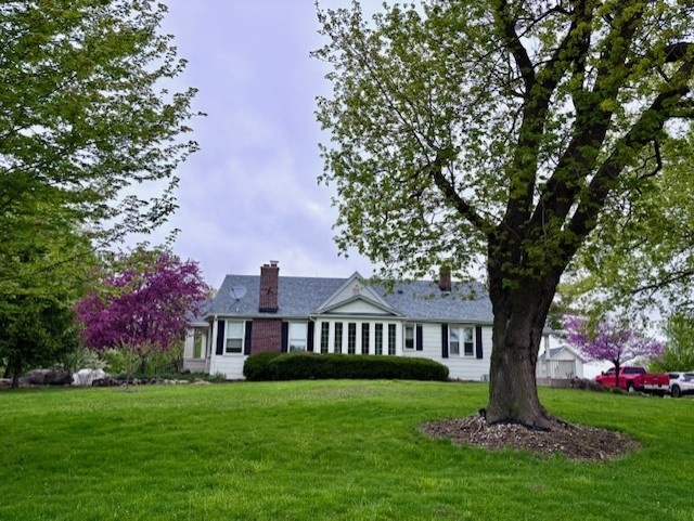 41955 North Mill Creek Road Wadsworth, IL 60083 - Photo 4 of 9 a front view of a house with garden