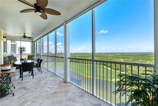 a view of two chairs in the balcony