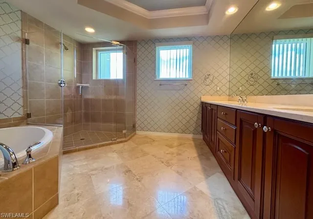 a bathroom with a bathtub and a sink