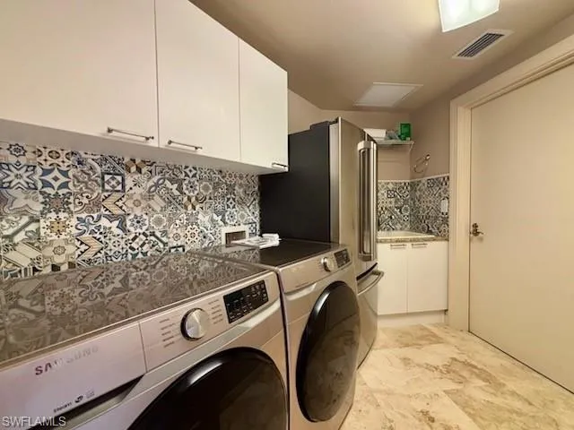 a utility room with dryer and washer