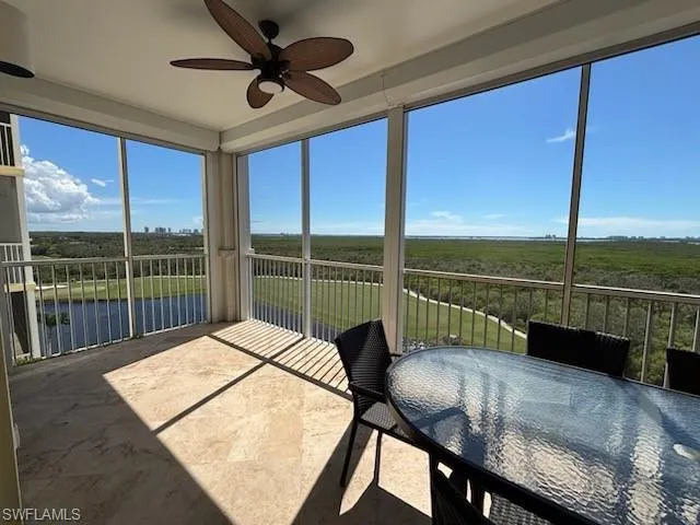a living room with hardwood floor and furniture