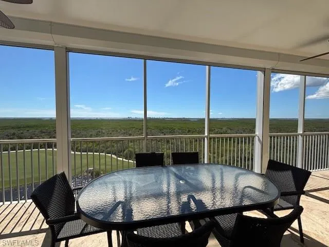 a view of a dining room with furniture window and outside view